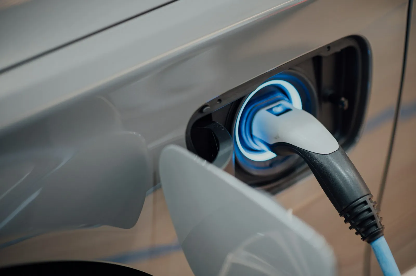 An electric car plugged in to charge